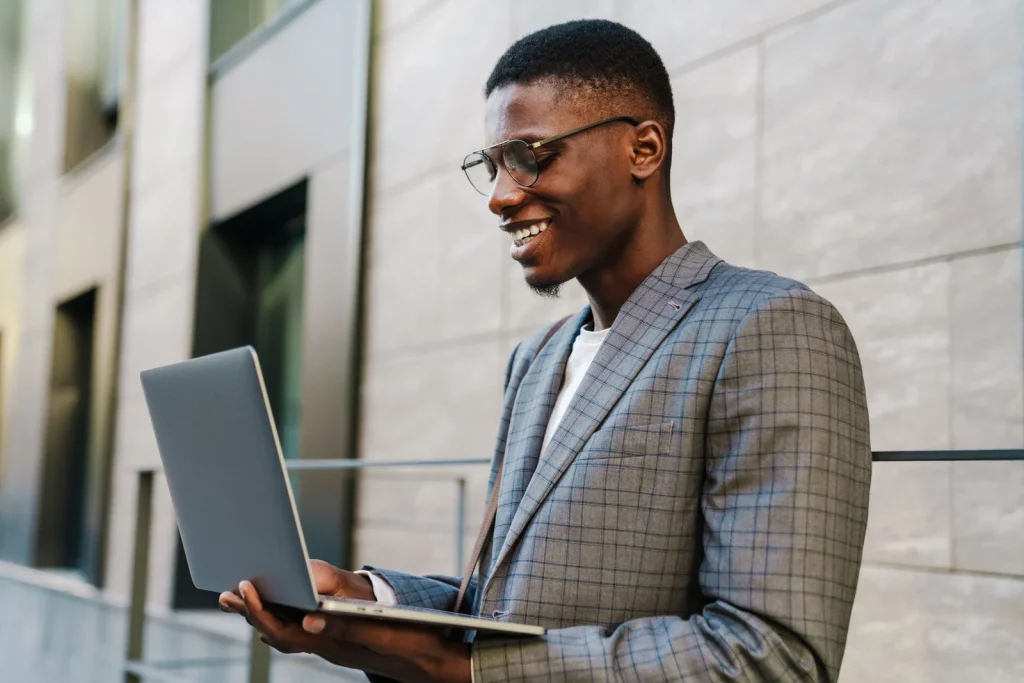 guy with notebook smiling