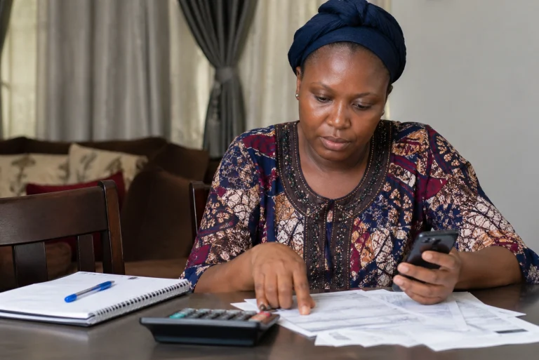 woman calculating loan fee at your calculator